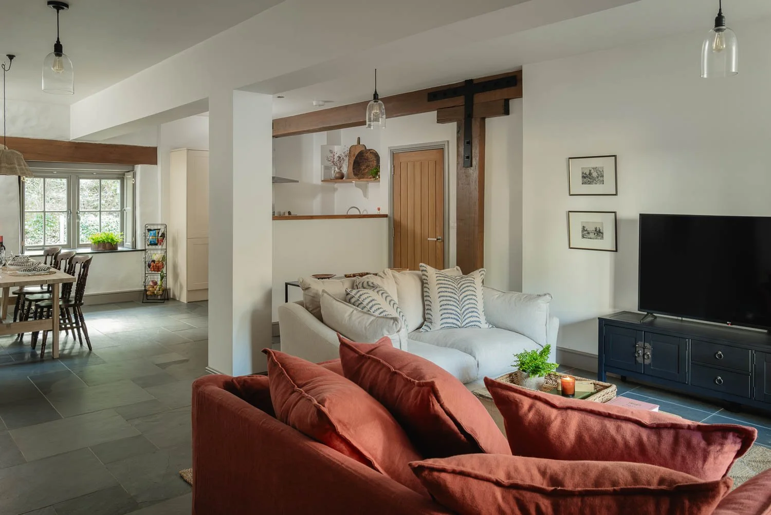 Living room with terracotta sofa at Perran Foundry, Cornwall, photographed by Pip Hambling