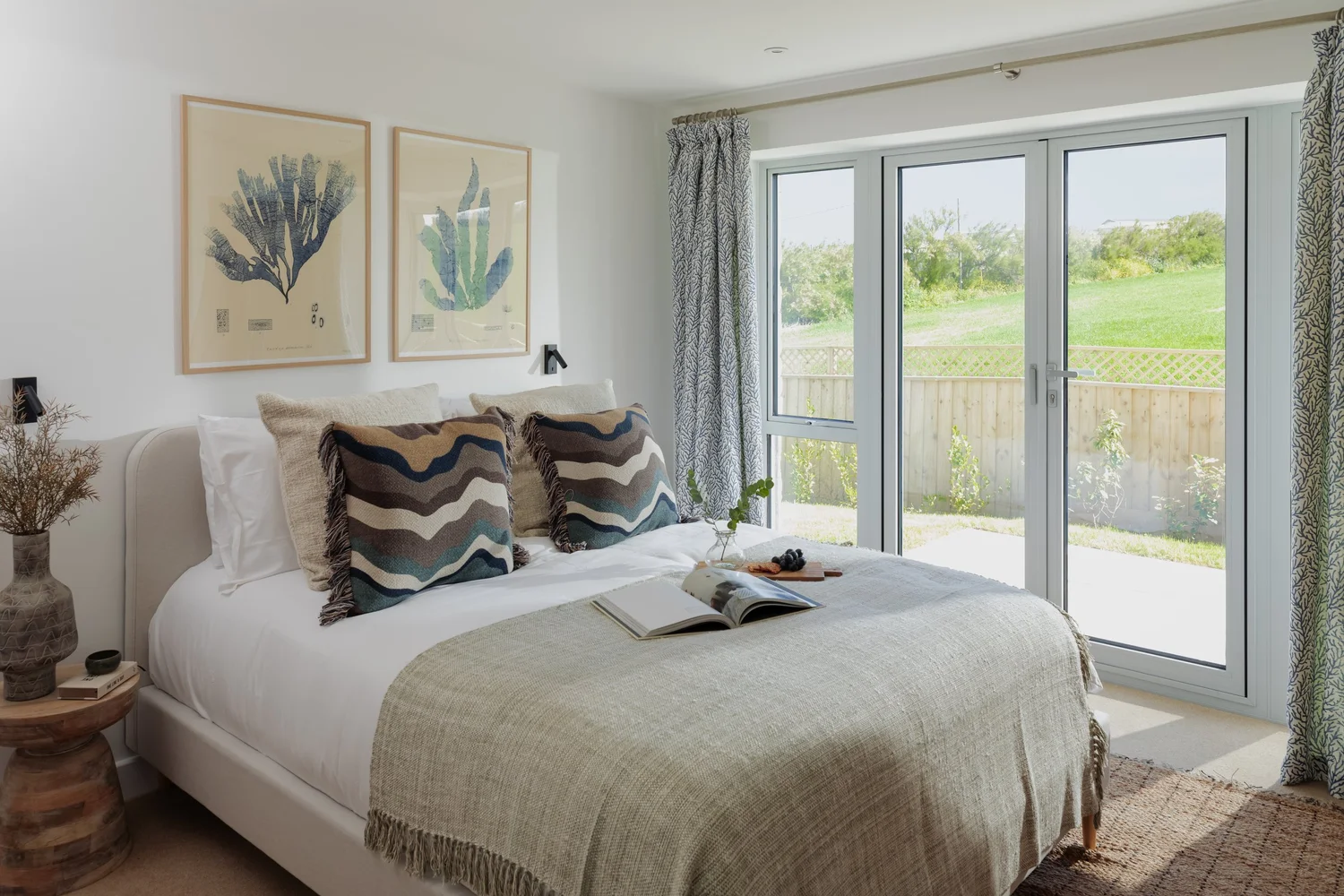 Calm bedroom with coastal light, Waterbeach Mews, Cornwall, photographed by Pip Hambling