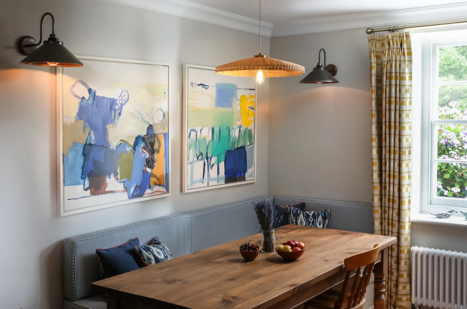 Living room with abstract painting at Coastguard Cottages, St Agnes, photographed by Pip Hambling