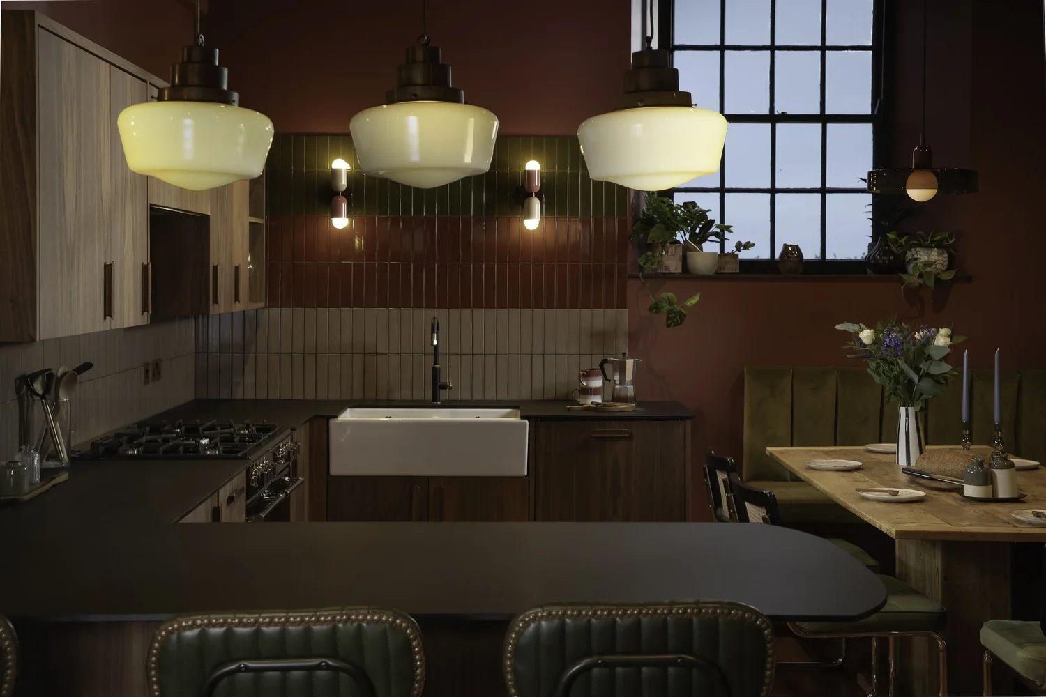 Dark kitchen with pendant lights at Zennor Sounds Studio, photographed by Pip Hambling