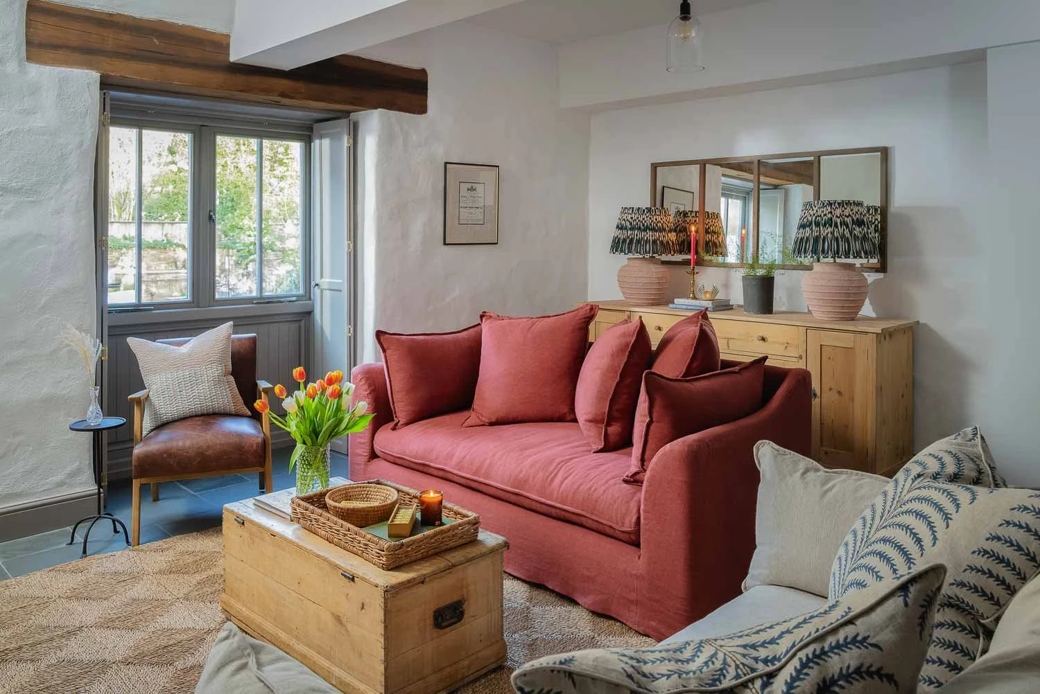 Pink sofa in a converted foundry living room, Perran Foundry, Cornwall, photographed by Pip Hambling
