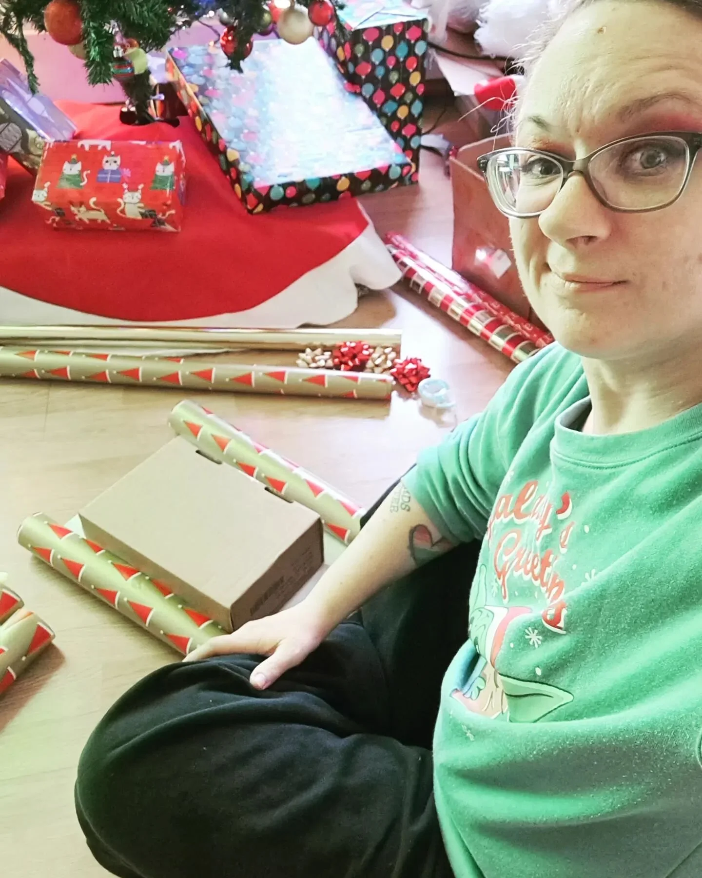 Dedication is wrapping prop presents for a studio tree (that you had to decorate) when you'll also have to wrap presents for your real tree (that you still have to decorate) at home.