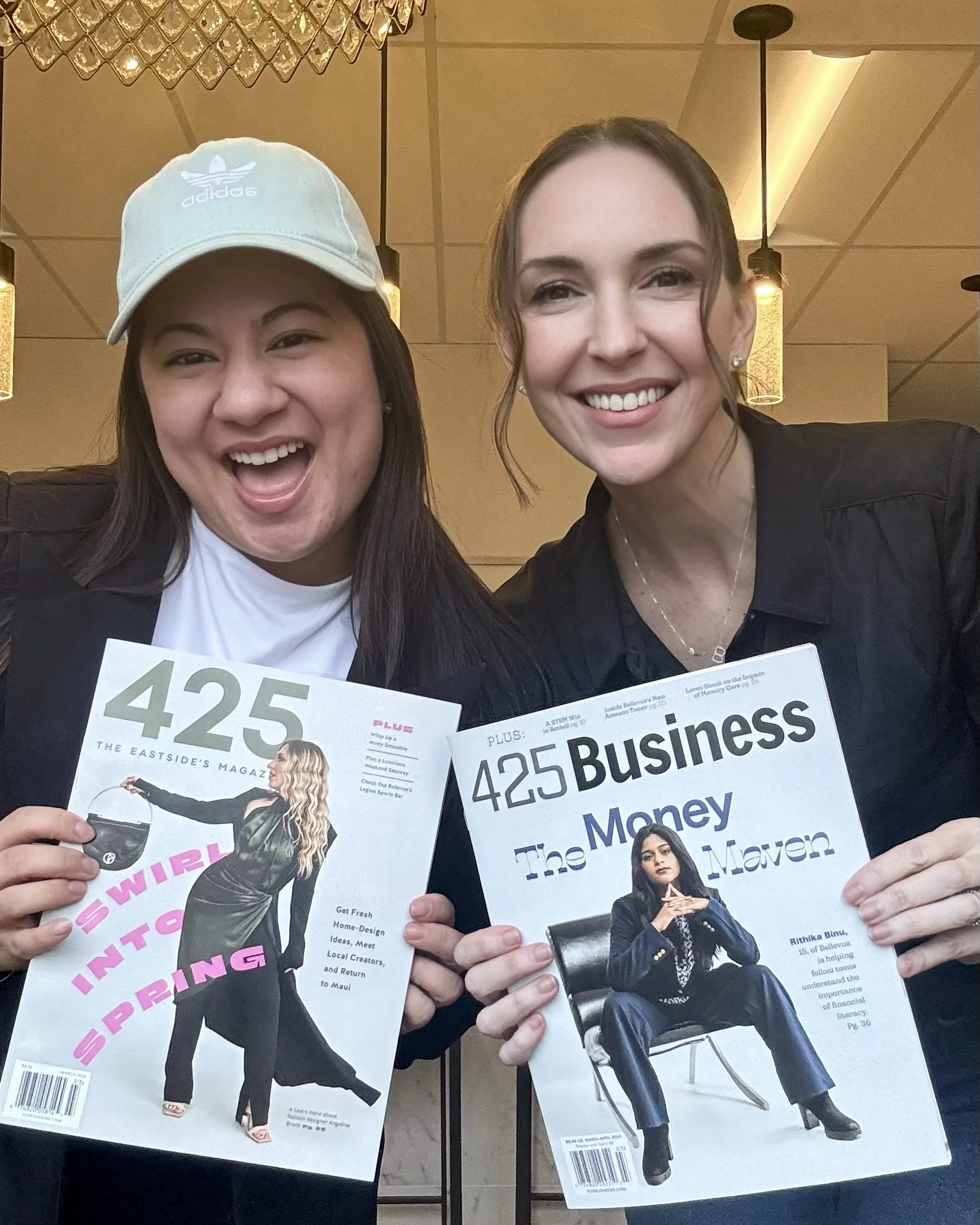 Studio B photographers Makayla and Brooke holding covers of 425 & 425 Business photograhed by yours truly