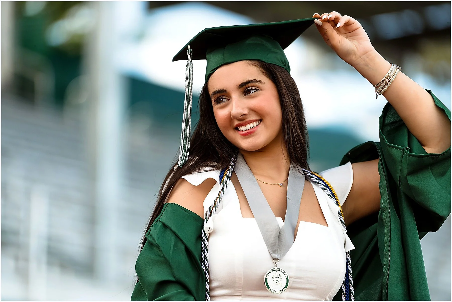 Skyline senior graduate cap & gown portrait