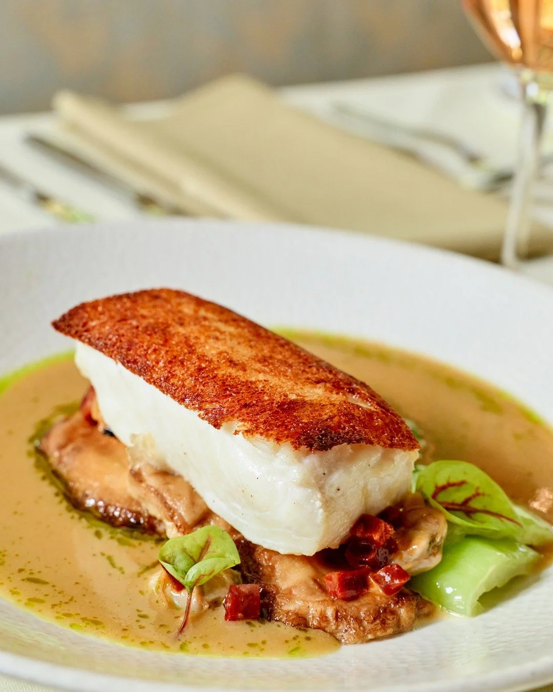 Halibut with chorizo, clams, fat moon mushroom, bok choy, &amp; lemongrass &quot;chowder&quot;.

📸 @briansamuelsphotography