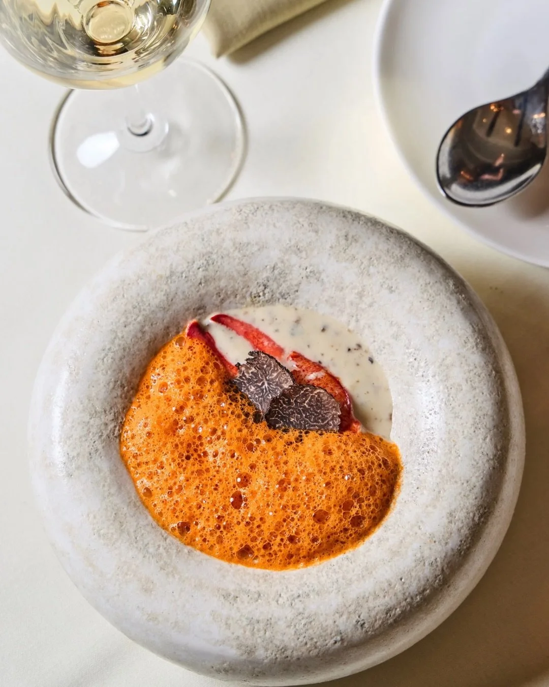 Black Truffle Cauliflower Soup with butter poached lobster, and lobster vanilla emulsion 🦞 One of the new amuse bouche offerings on Chef Robert&rsquo;s six-course tasting menu, served daily. 

📸: @briansamuelsphotography