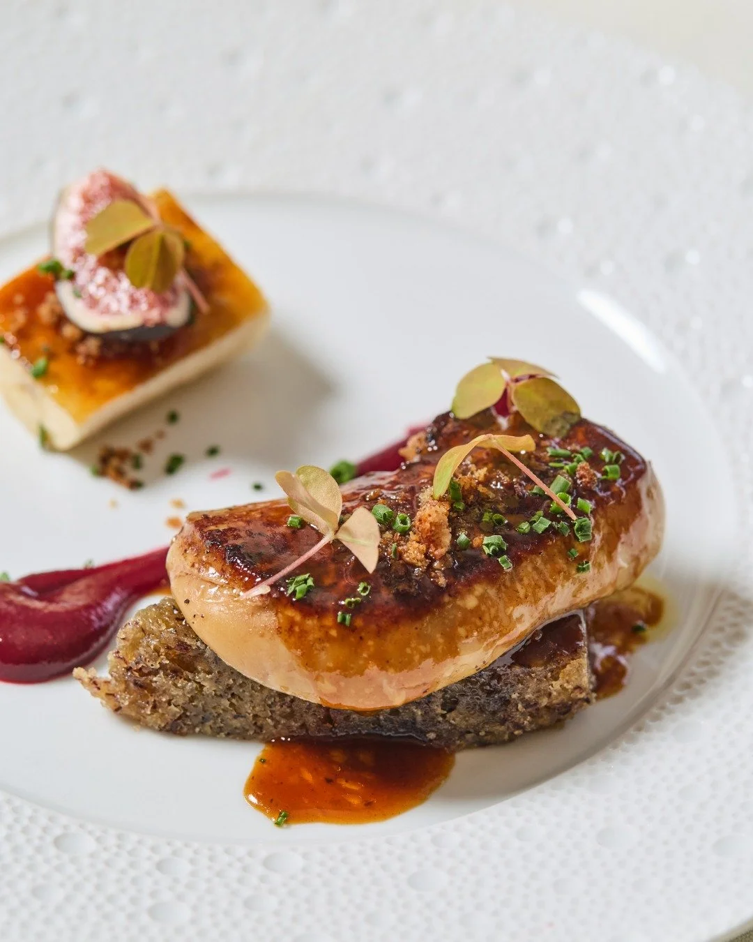 Indulge: Seared Foie Gras with walnut, banana, and fig, served daily on Chef Robert&rsquo;s six-course tasting menu.

📸 @briansamuelsphotography
