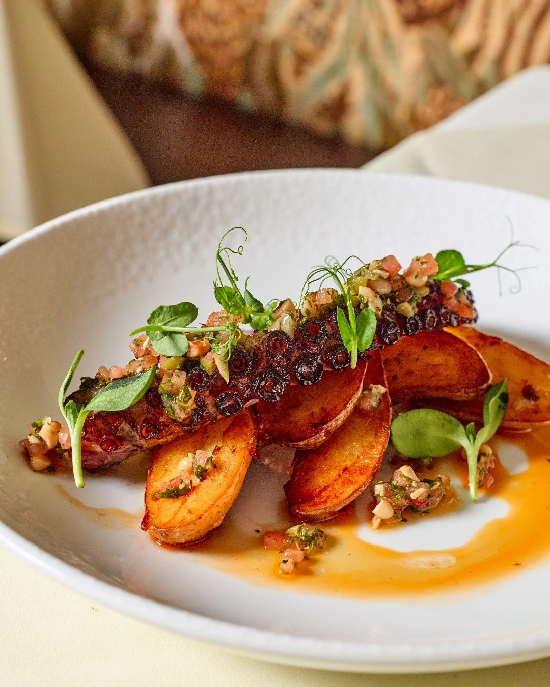 Spanish Octopus | pine nut, castelvetrano olive, caper, chorizo oil

📸 @briansamuelsphotography