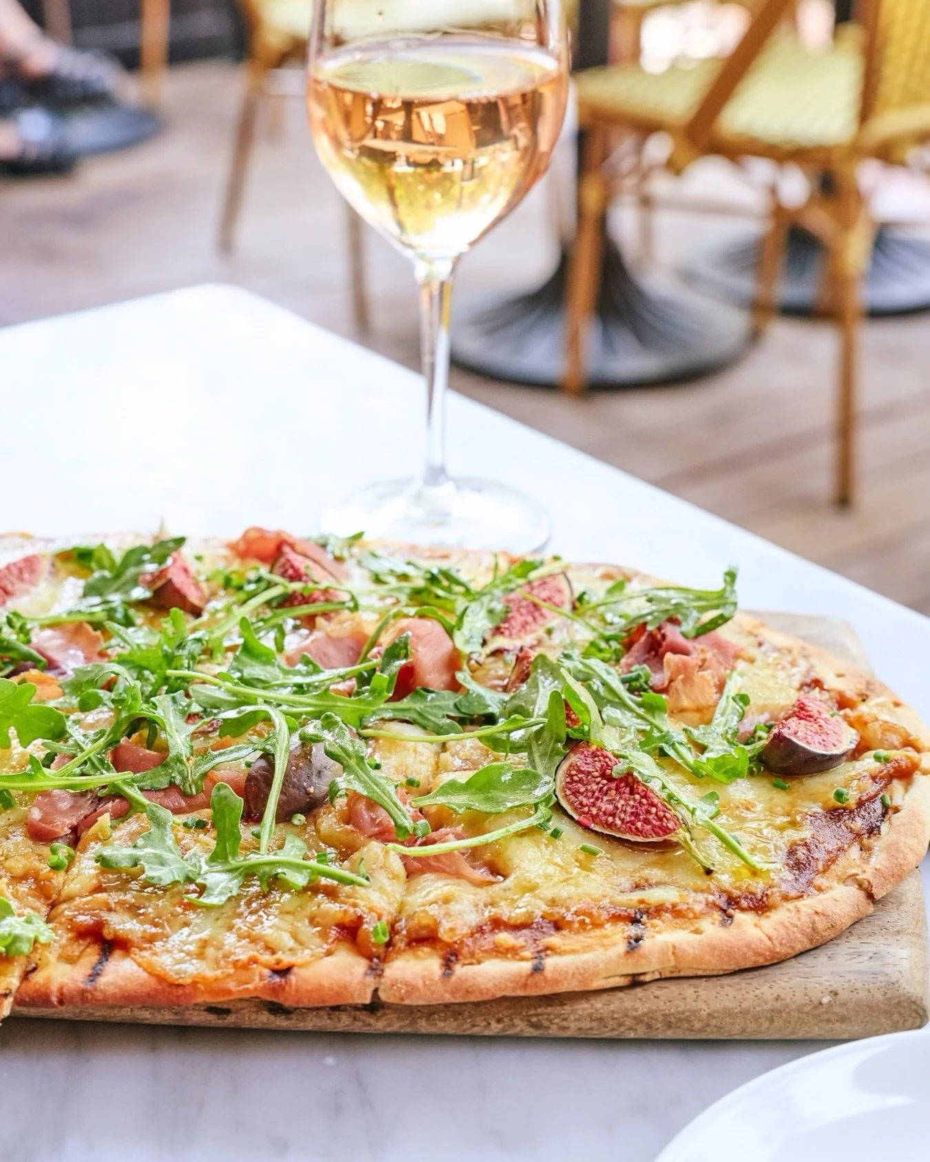 A perfect pairing: our French Onion flatbread and a glass of Sancerre&mdash;see you on the patio.

📸 @briansamuelsphotography