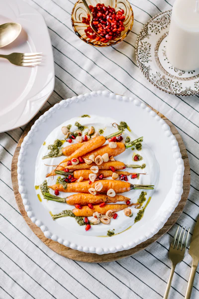 2Dutch_Carrots_with_Yoghurt_Coriander_Oil_Hazelnuts_and_Jewelled_Pomegranate_2_600x600 copy.png