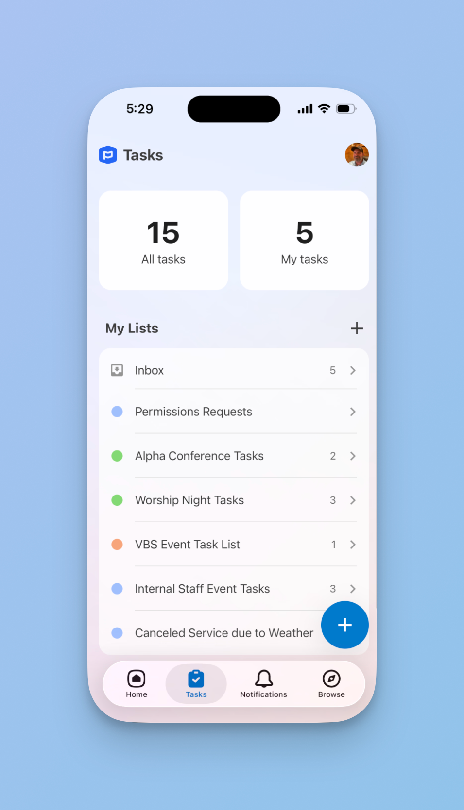 Planning Center mobile app Tasks screen showing 15 total tasks and 5 personal tasks, with a My Lists section containing seven task lists including Inbox and several event-specific lists. A blue floating action button appears in the lower right.