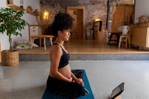 Pregnant woman in a yoga pose