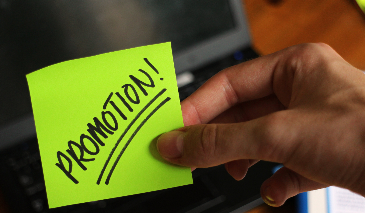 Team leader having a supportive one-on-one conversation with an employee who didn't receive a promotion