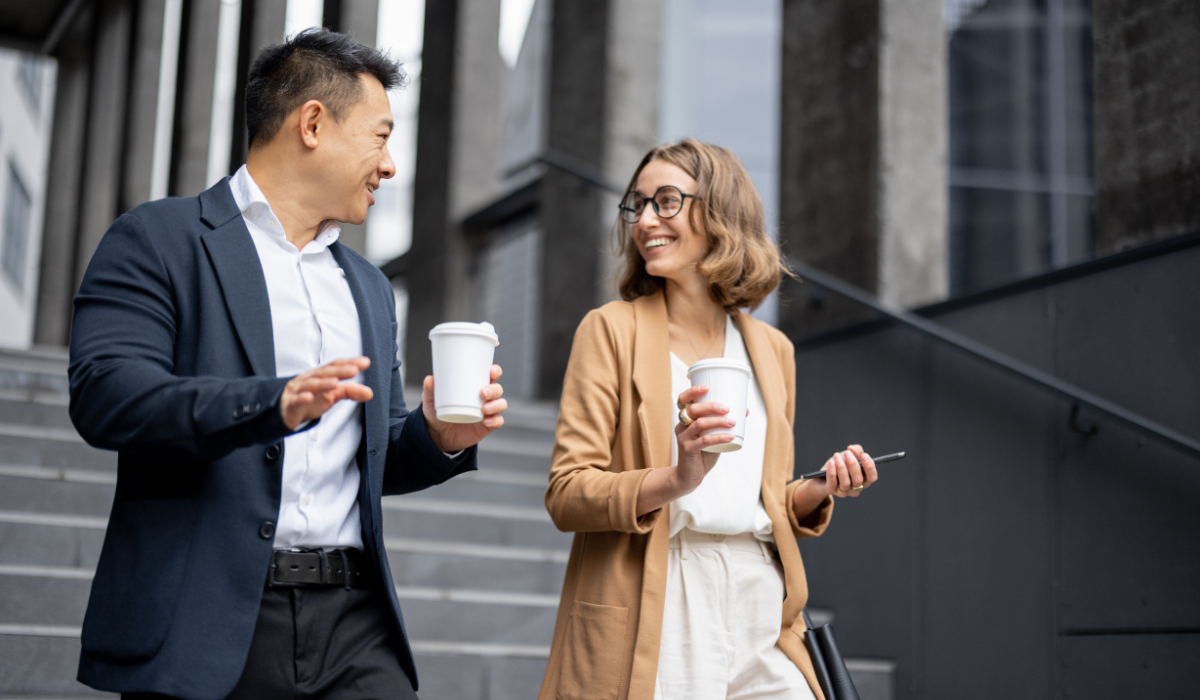 Two colleagues repairing a workplace relationship through an honest, empathetic conversation