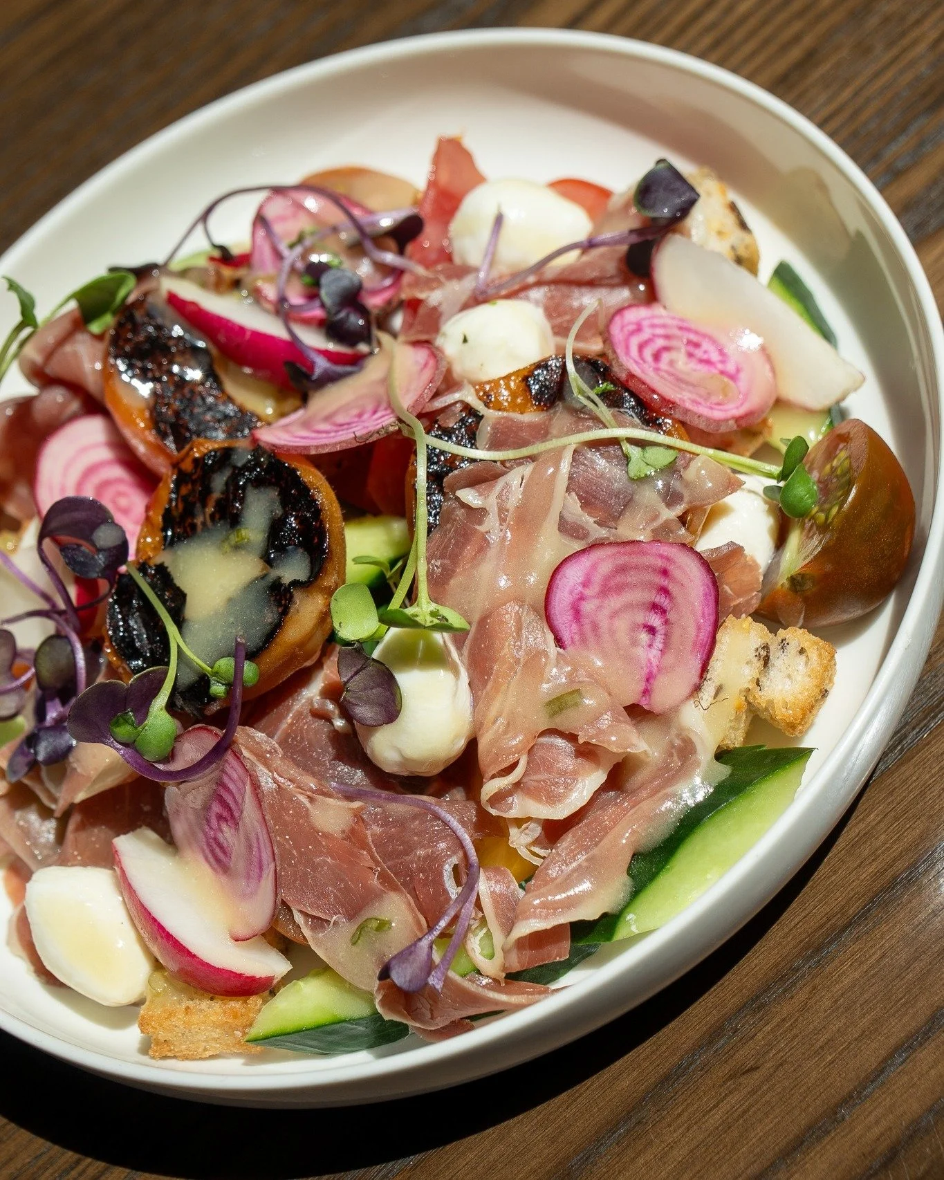 something a bit extra for your lunchtime salad. 

stone fruit panzanella salad
charred seasonal stone fruit, prosciutto, croutons, mozzarella pearls, honey mustard dressing.