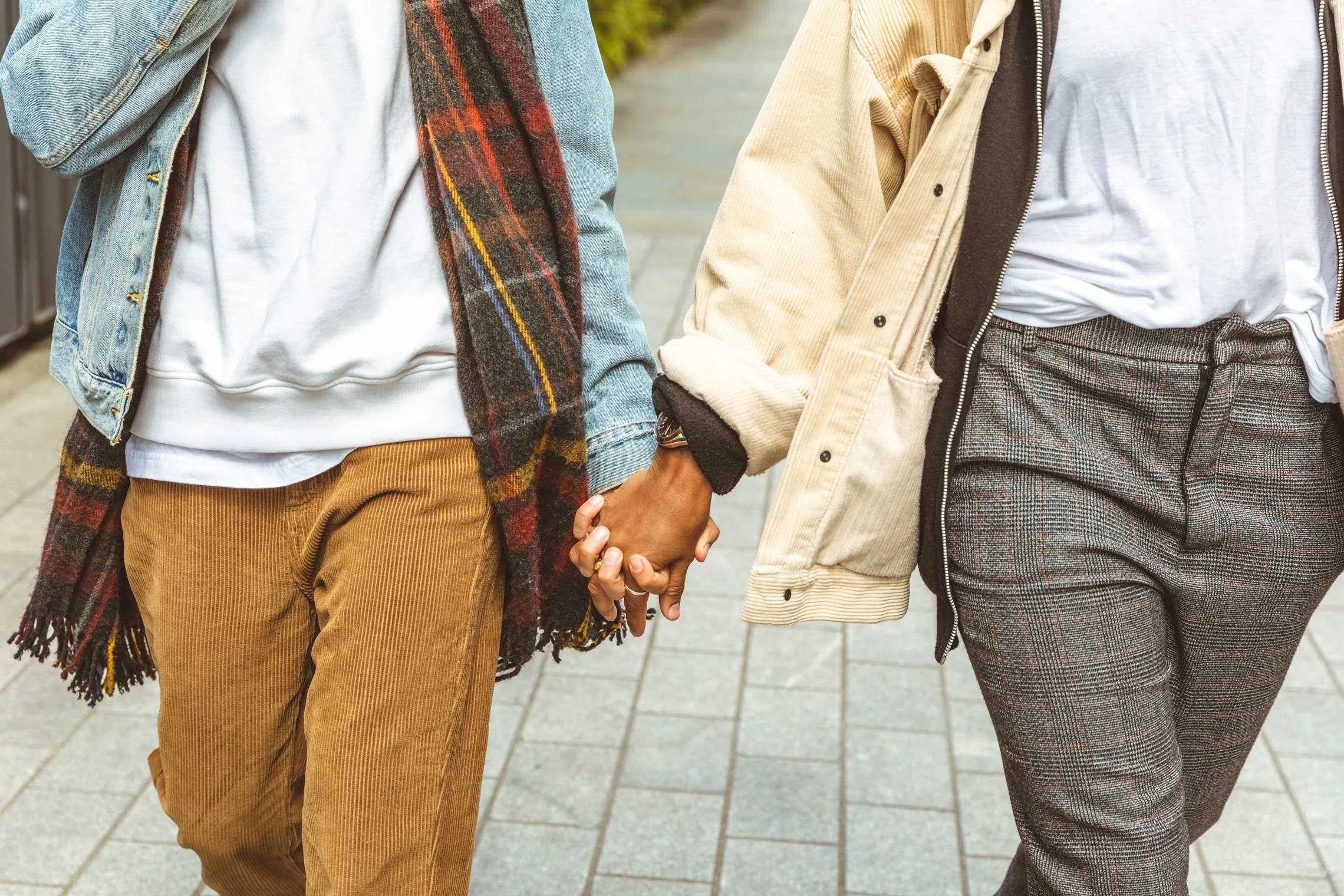 Gay Black couple holding hands — LGBTQ affirming couples therapy in Maryland