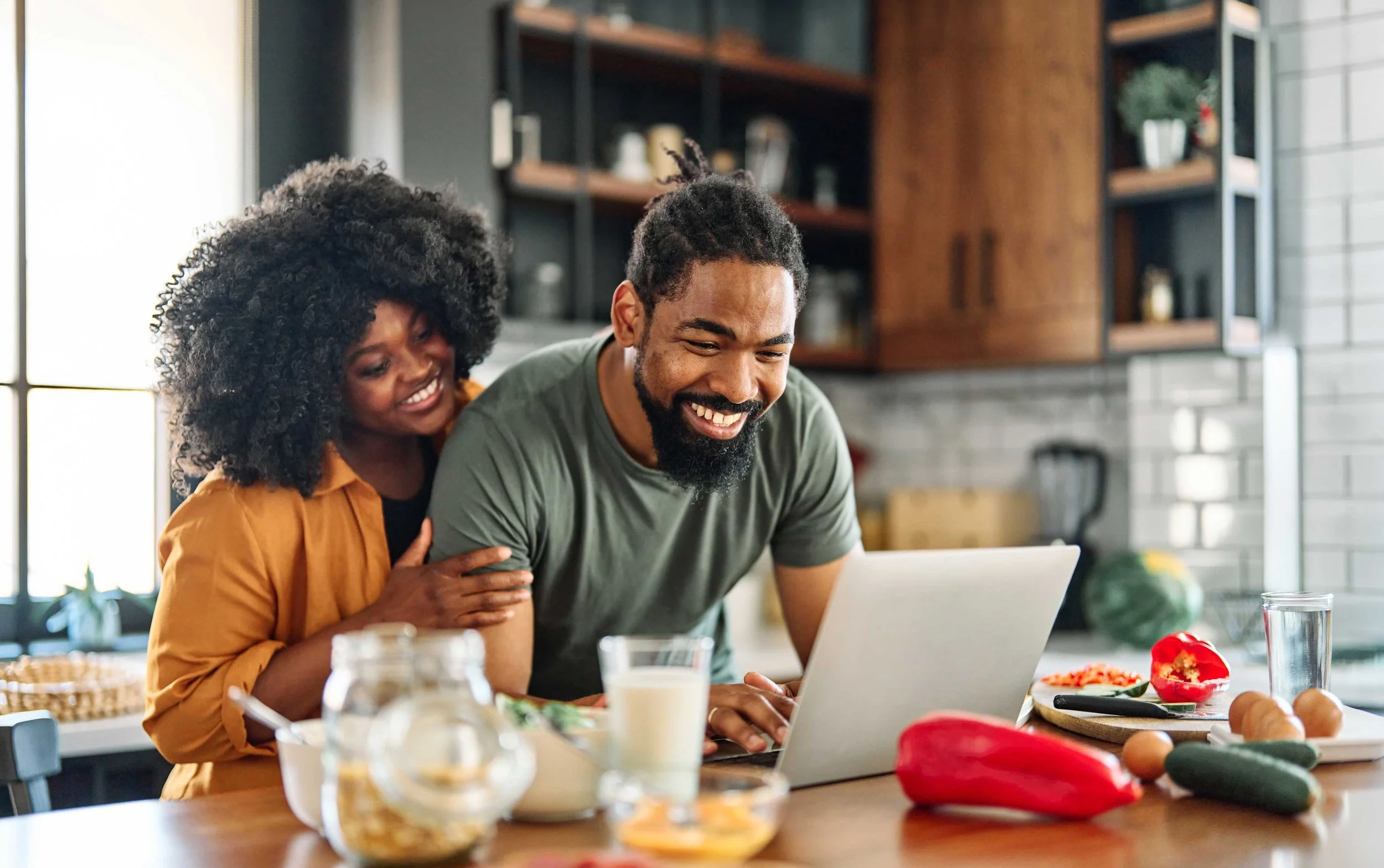 Happy Black couple during telehealth therapy session — virtual couples counseling DC