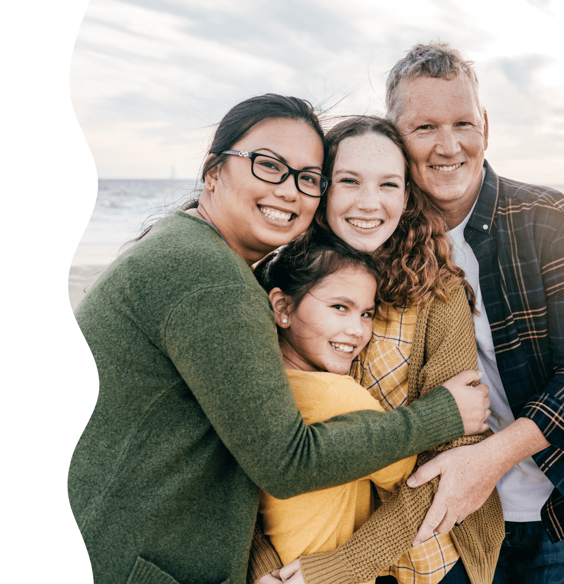 Parents with adolescent kids at the beach