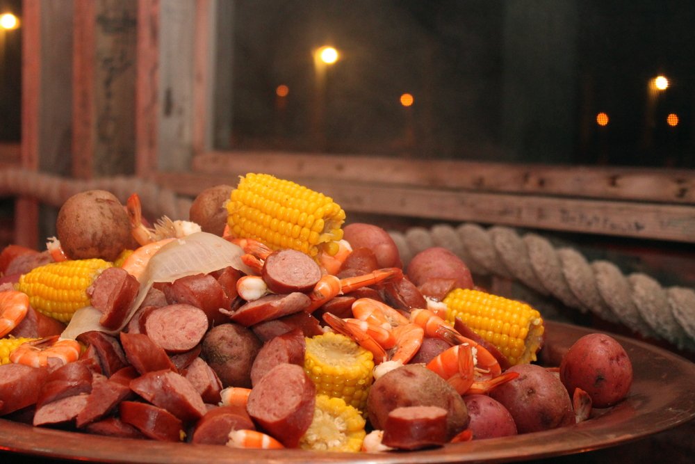 A plate of lowcountry boil at the Smoking Pot with some shrimp, corn, and sausage slices