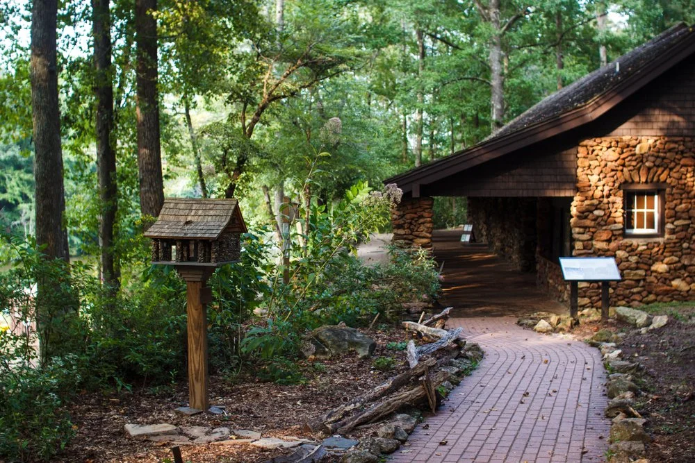 A stone path leading to a cabin at Paris Mountain State Park