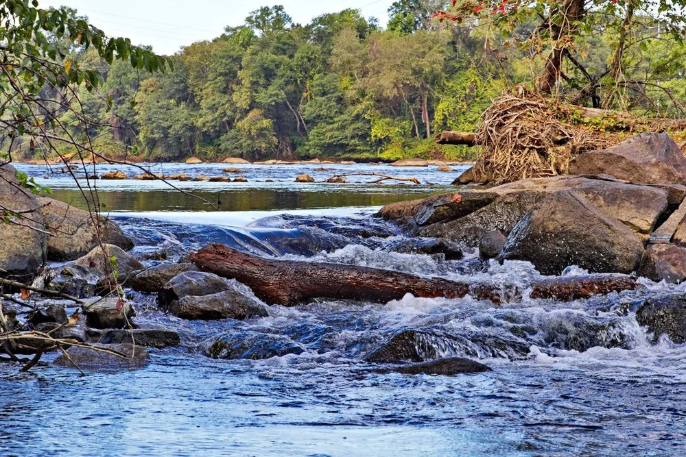 The Catawba River flowing through some rocks as seen from the Carolina Thread Trail