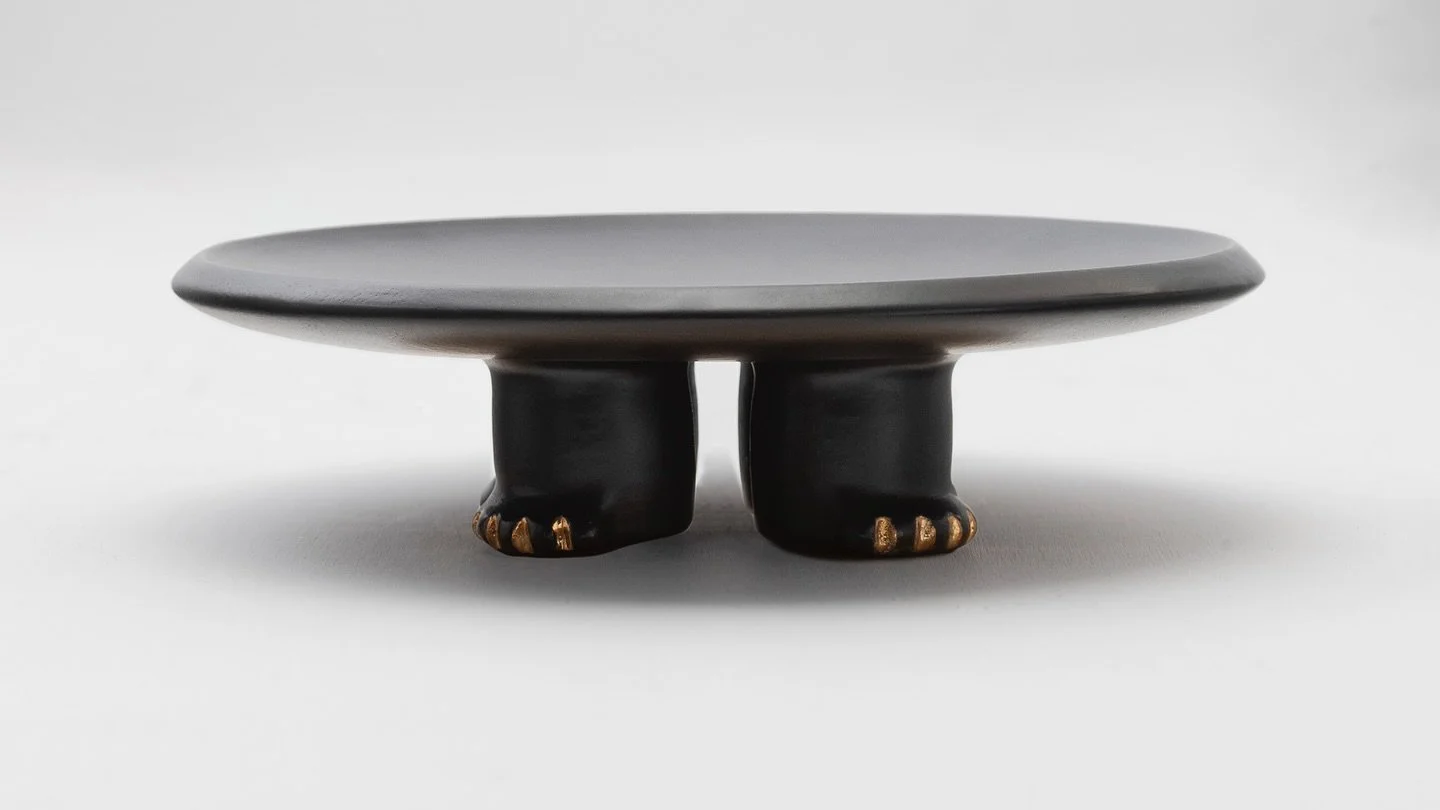 JAMA DECORATIVE PLATTER
Decorative slip casted ceramic platter finished with a rich black or dark green glaze, highlighted with gold luster details.
Inspired by Jama-Coaque (350 BC - 1532 AD), a circular censer or table that combines animal and hum