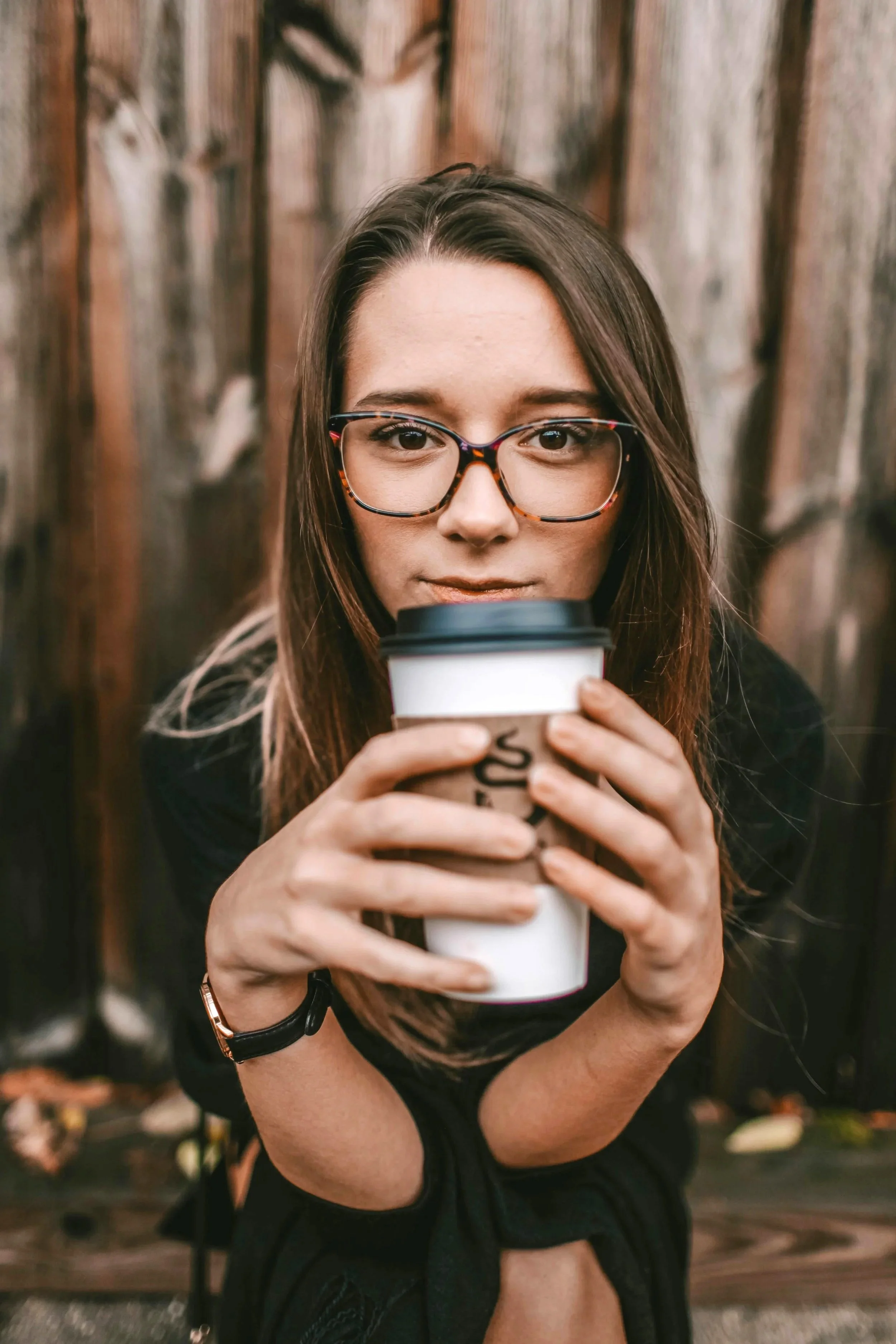young woman holding coffee cup