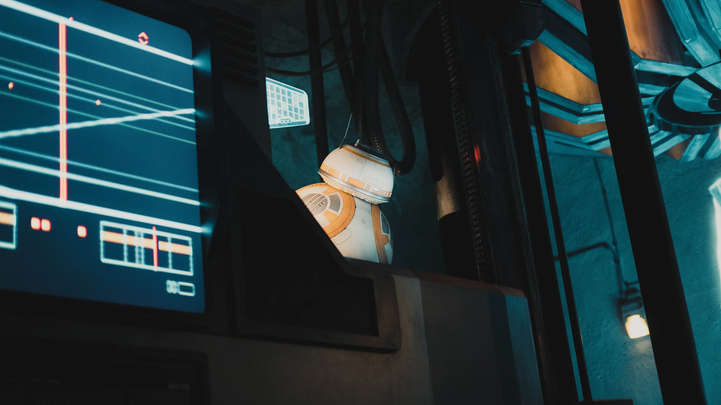 A spaceship model and parts of a control panel with a sci-fi themed display on a computer screen.