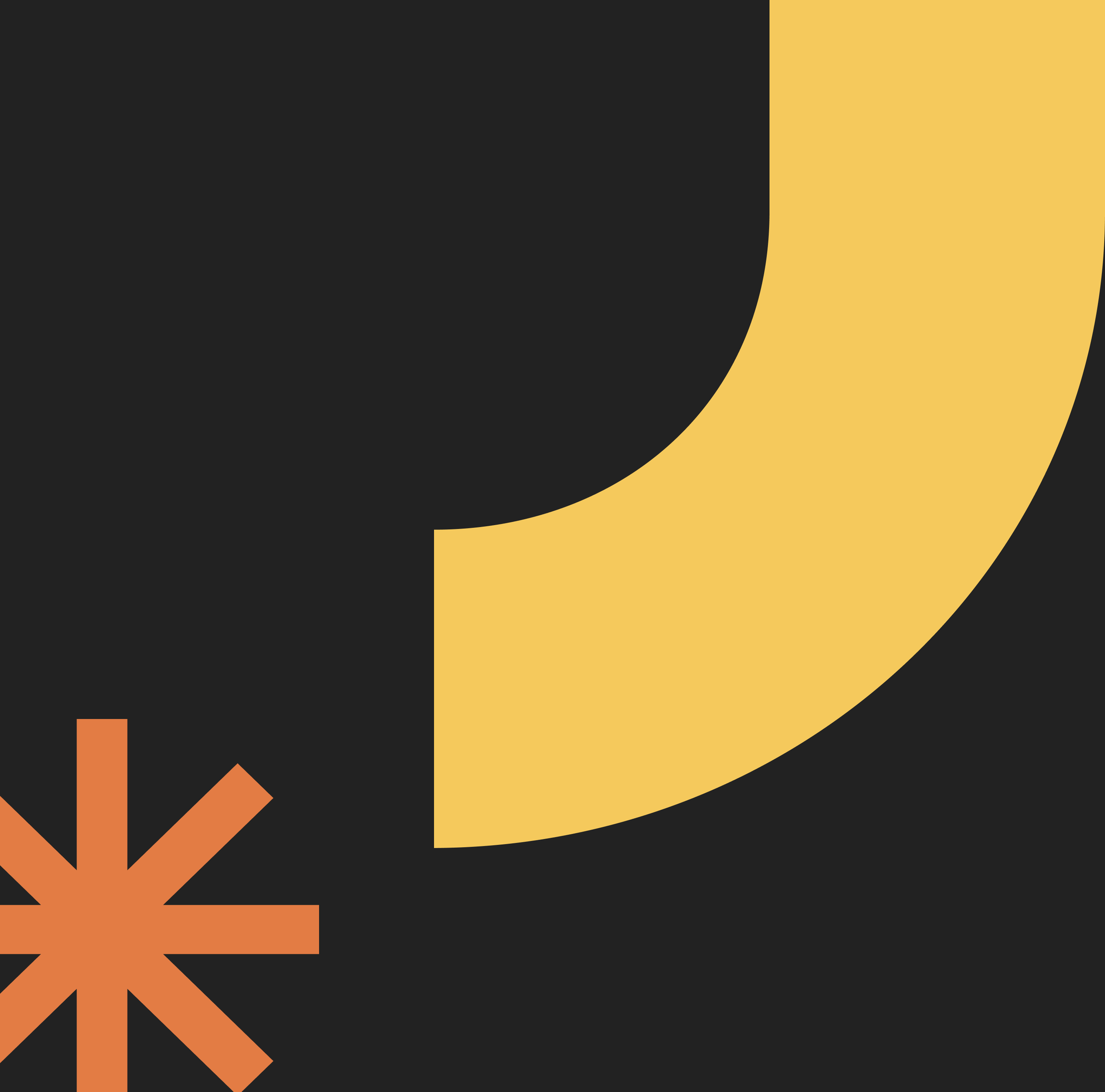 Close-up of a graphic or illustration with black, yellow, and orange elements, including a partial black circle and a starburst design.