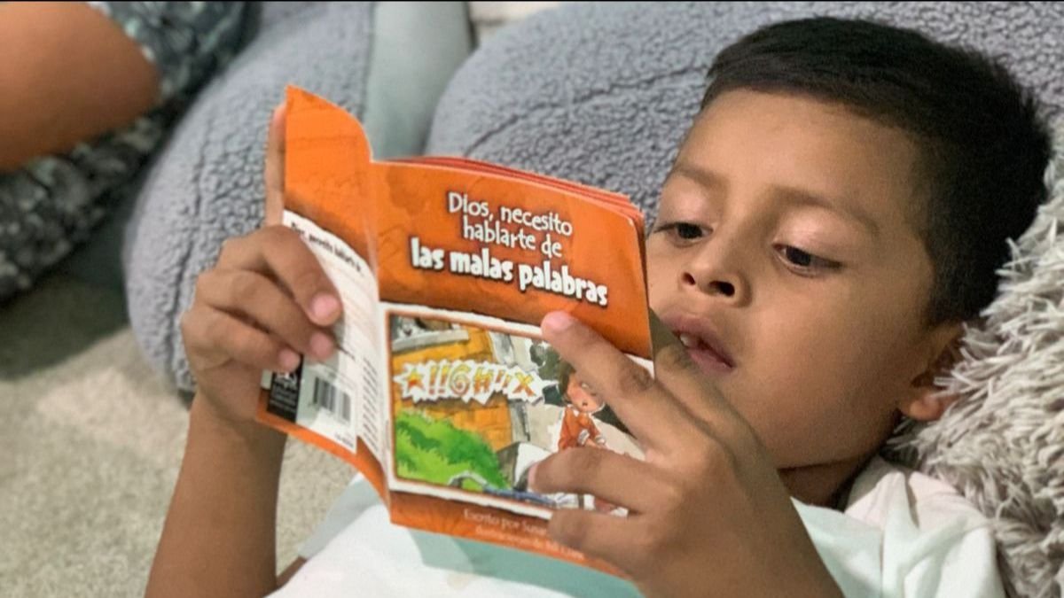 A boy decided to sit still to read books in our library, but he almost gave up in the first minutes because it was too boring for him. So, one of us sat with him to encourage reading. He read a book called “God, I need to talk to you about bad words.