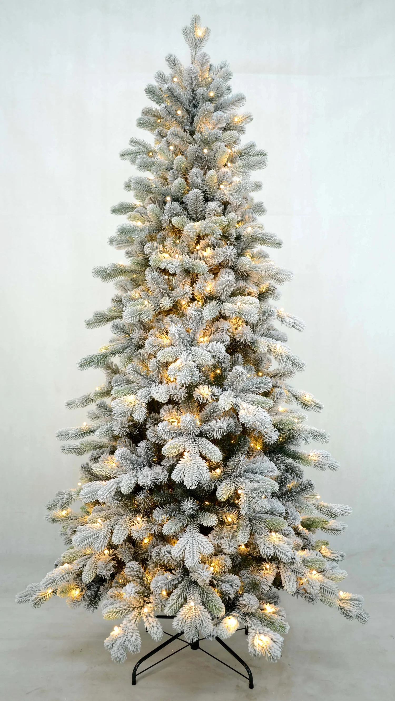 Pre-lit flocked artificial Christmas tree