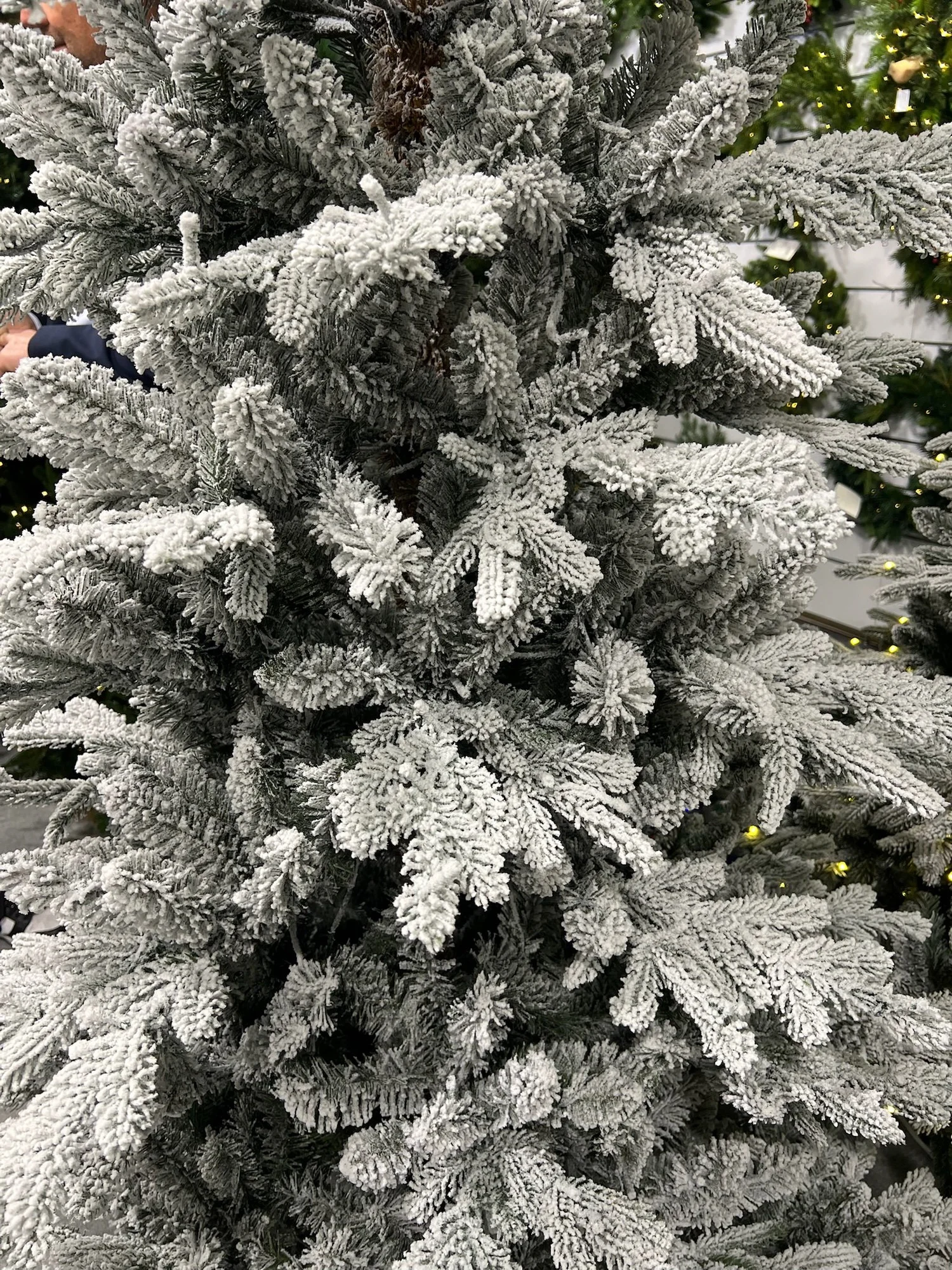 Close-up of flocked artificial pine branches