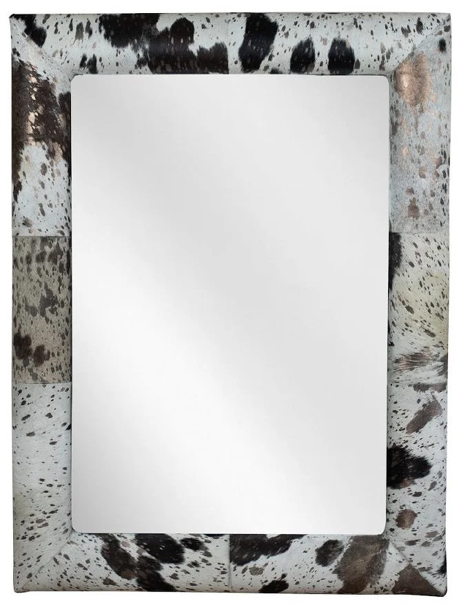 Blank white sheet of paper on a speckled, black and white countertop surface.