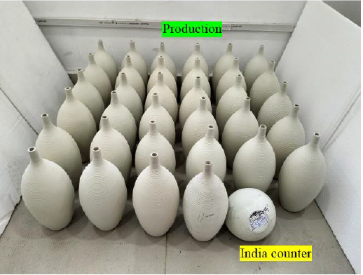 Collection of pottery vases under quality control, with the approved control sample labeled 'India counter' nearby.