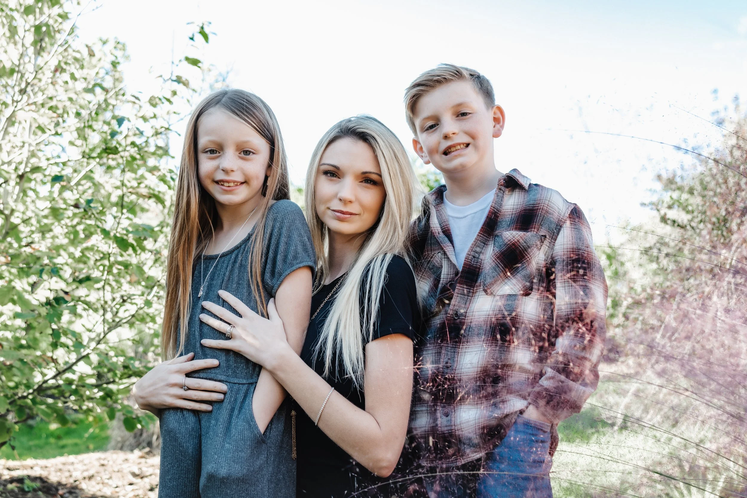 mother with son and daughter family portrait at nathanael greene park in springfield missouri