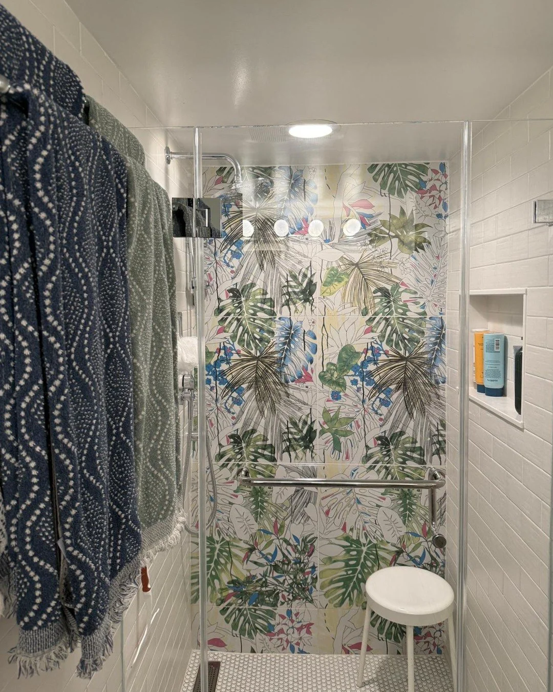 Dare to go bold in the bathroom. Here we went with @Tilebar's large format tile, and the colors of the leaves made it the perfect fit. I knew my client was fun, artsy, and takes chances so this bold choice felt right for her personality. Sometimes th