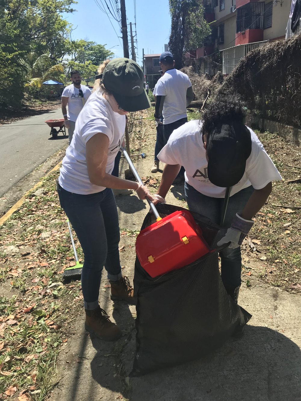  AD&amp;V team members picking up trash for cleanup 