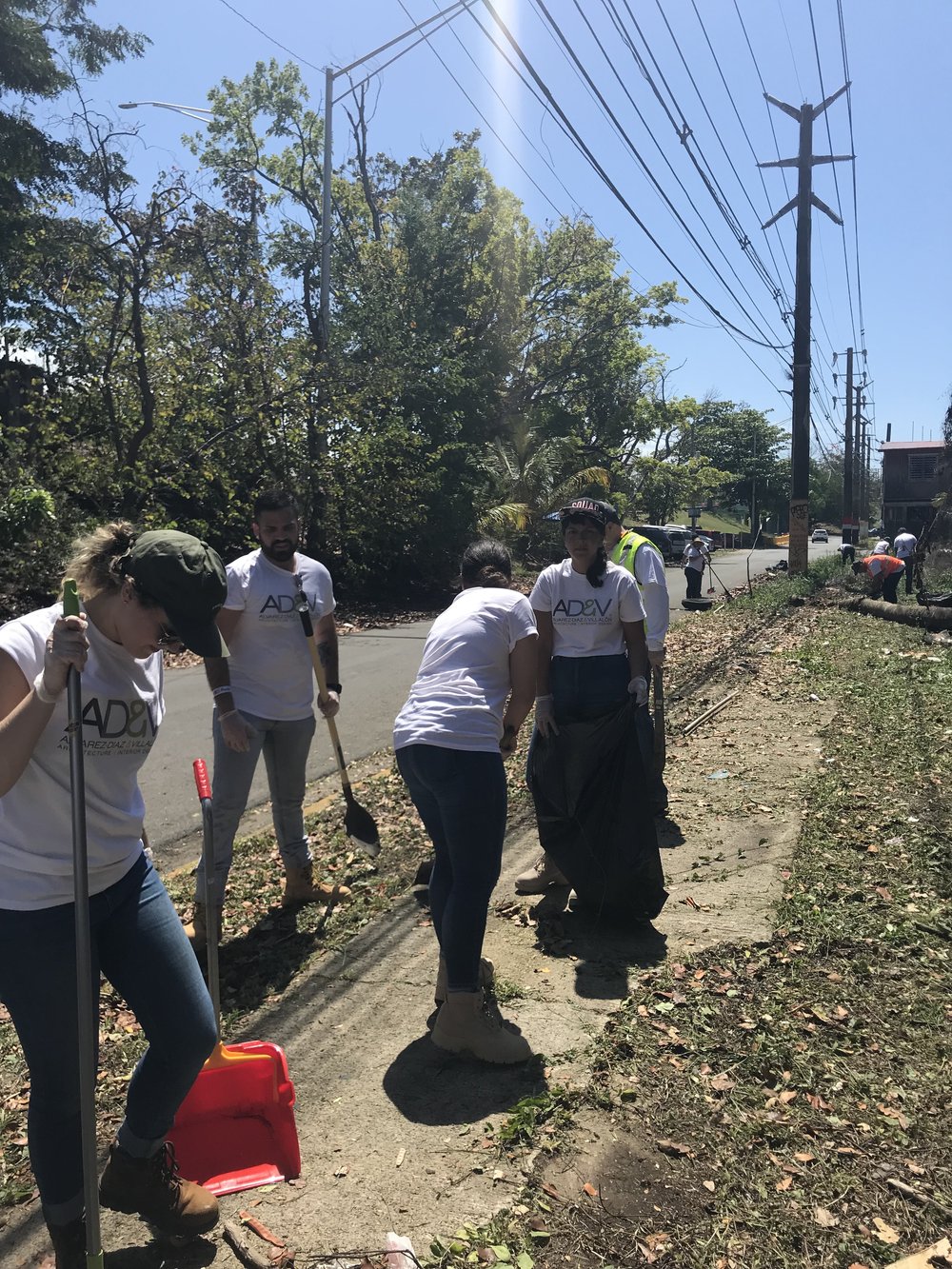  AD&amp;V team members picking up trash for cleanup 