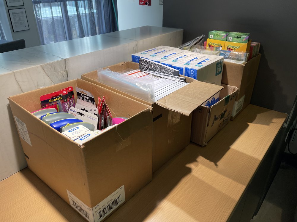  Boxes filled with school supplies. 