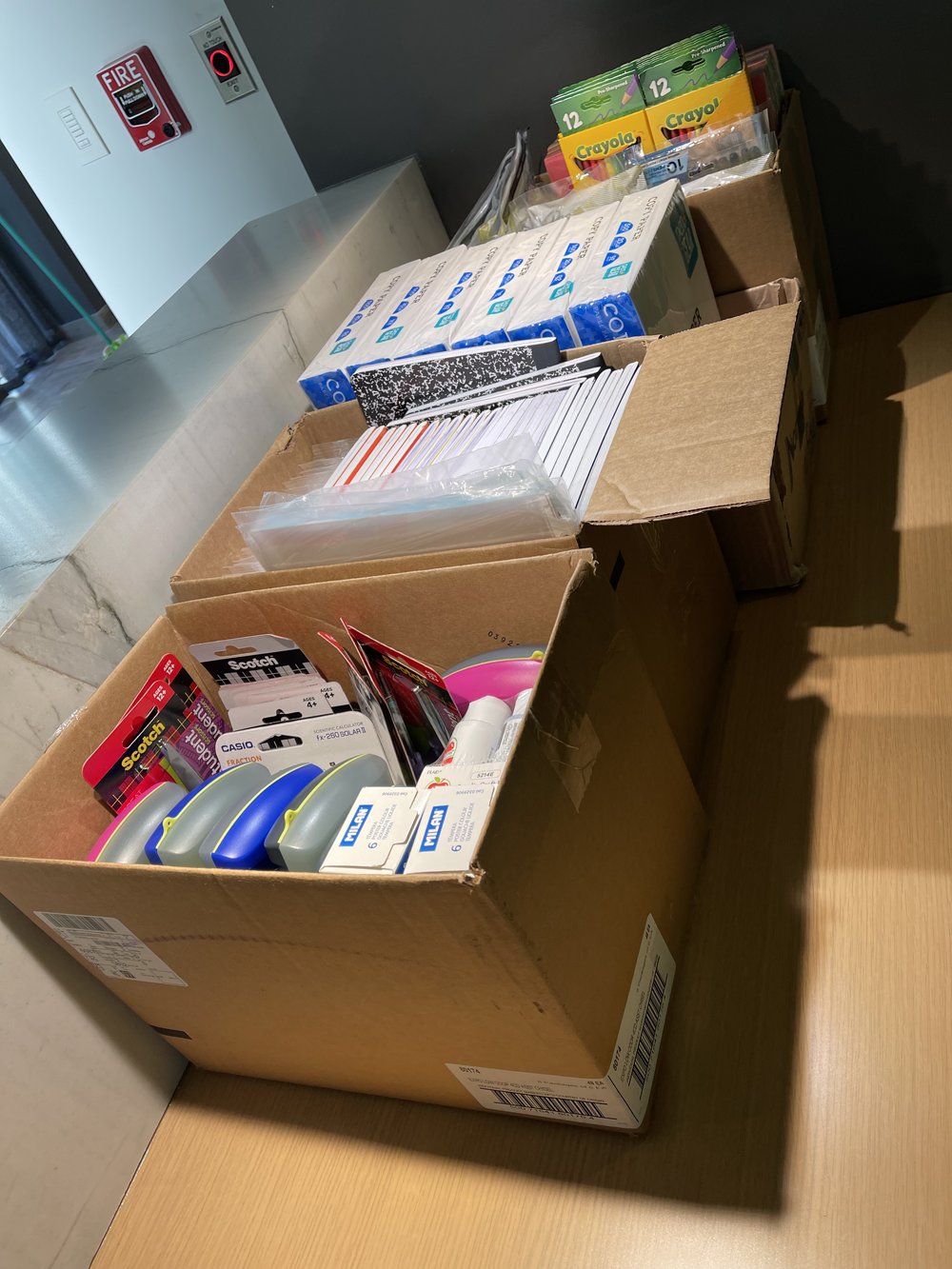  Closeup of school supplies inside of a box. 