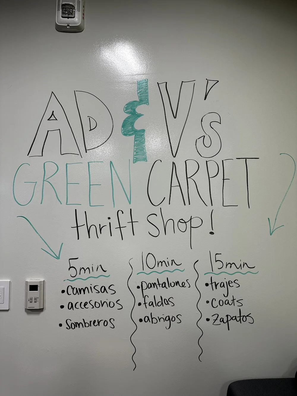  Clothes placed in the AD&amp;V green carpet thrift shop. 