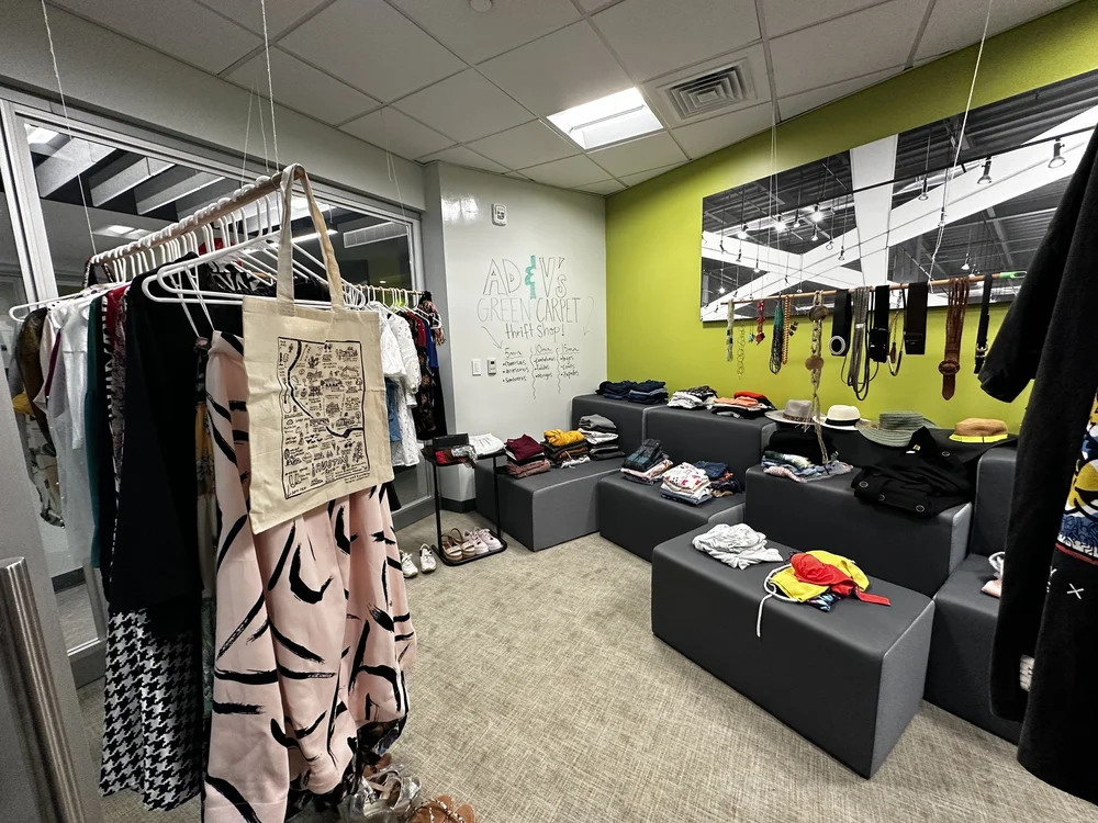  Clothes placed in the AD&amp;V green carpet thrift shop. 