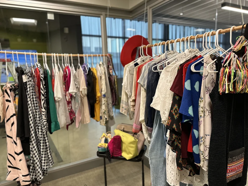  Clothes placed in the AD&amp;V green carpet thrift shop. 