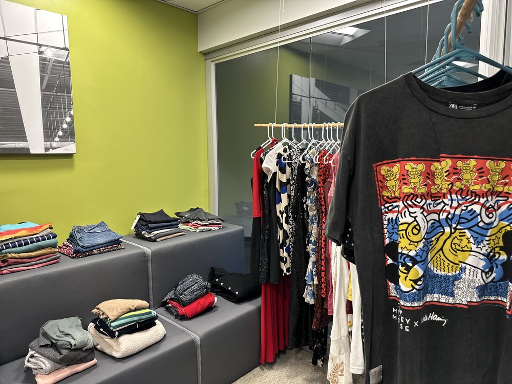  Clothes placed in the AD&amp;V green carpet thrift shop. 