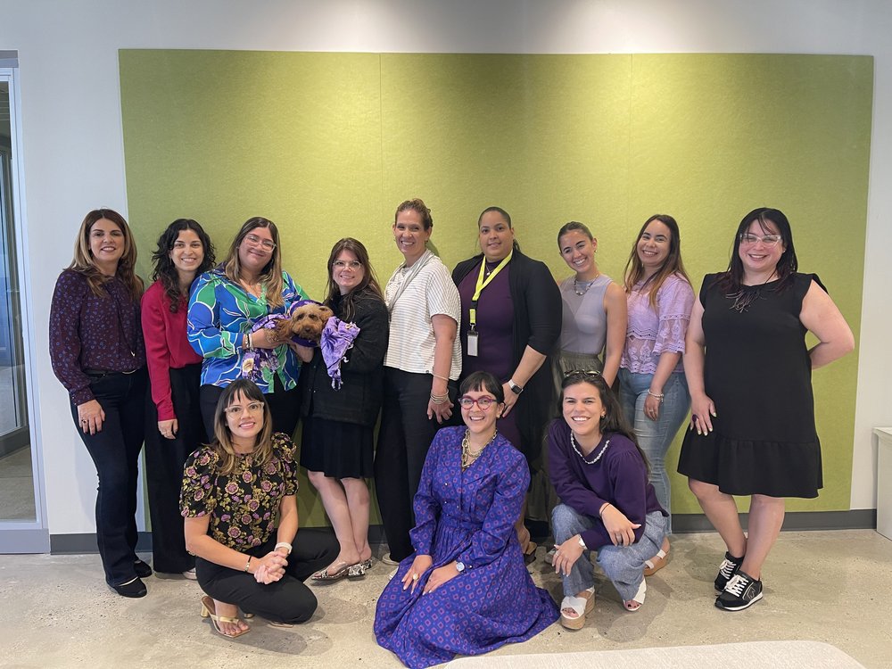  AD&amp;V team members wearing purple in support of the #DeVioletaPorEllos initiative.  