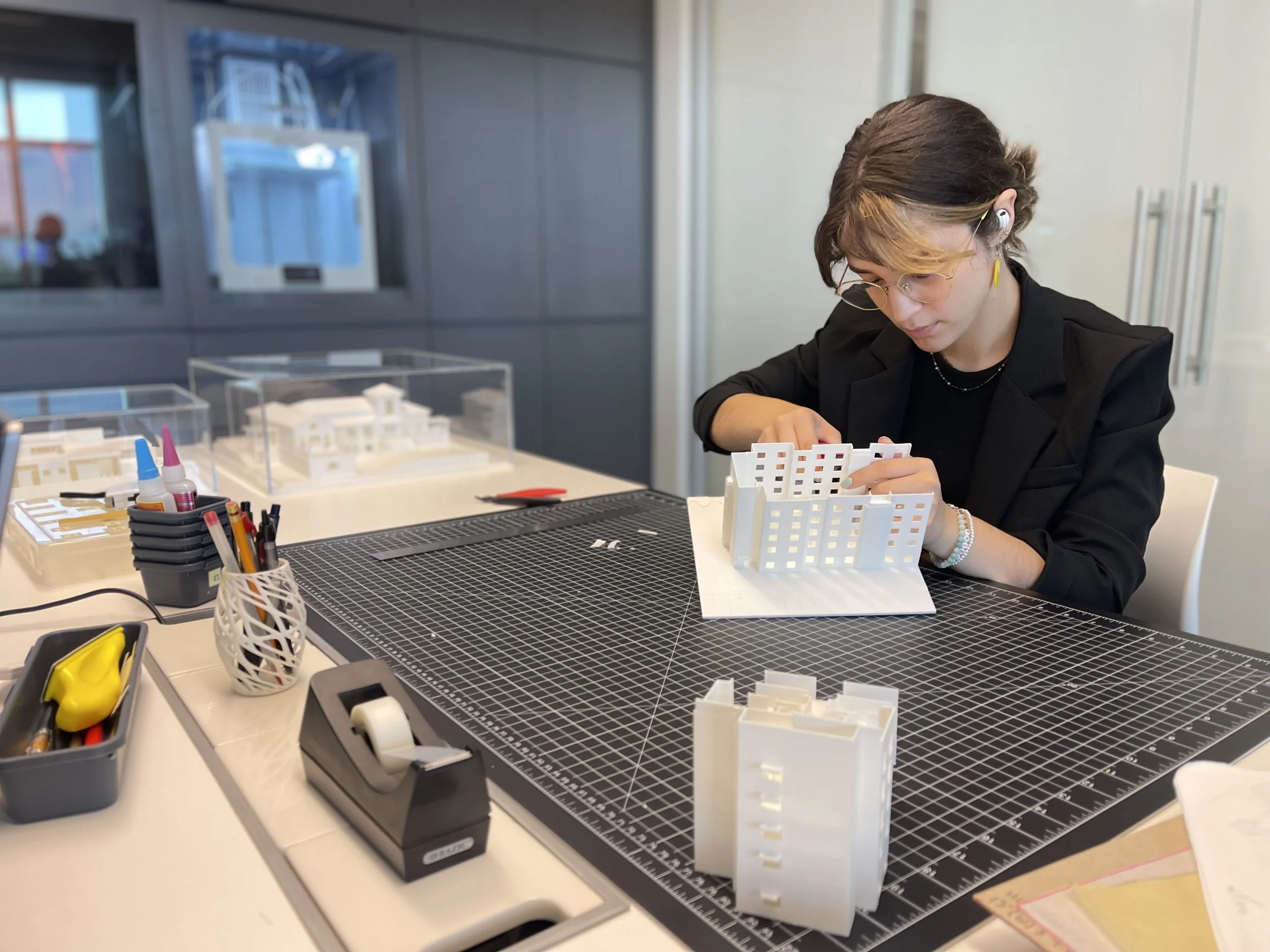 Intern working on a project model.