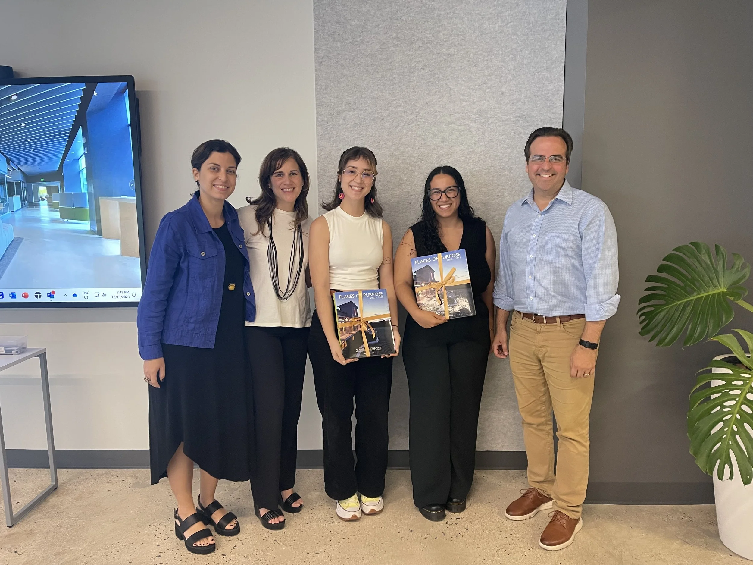 Interns posing with the AD&V team.