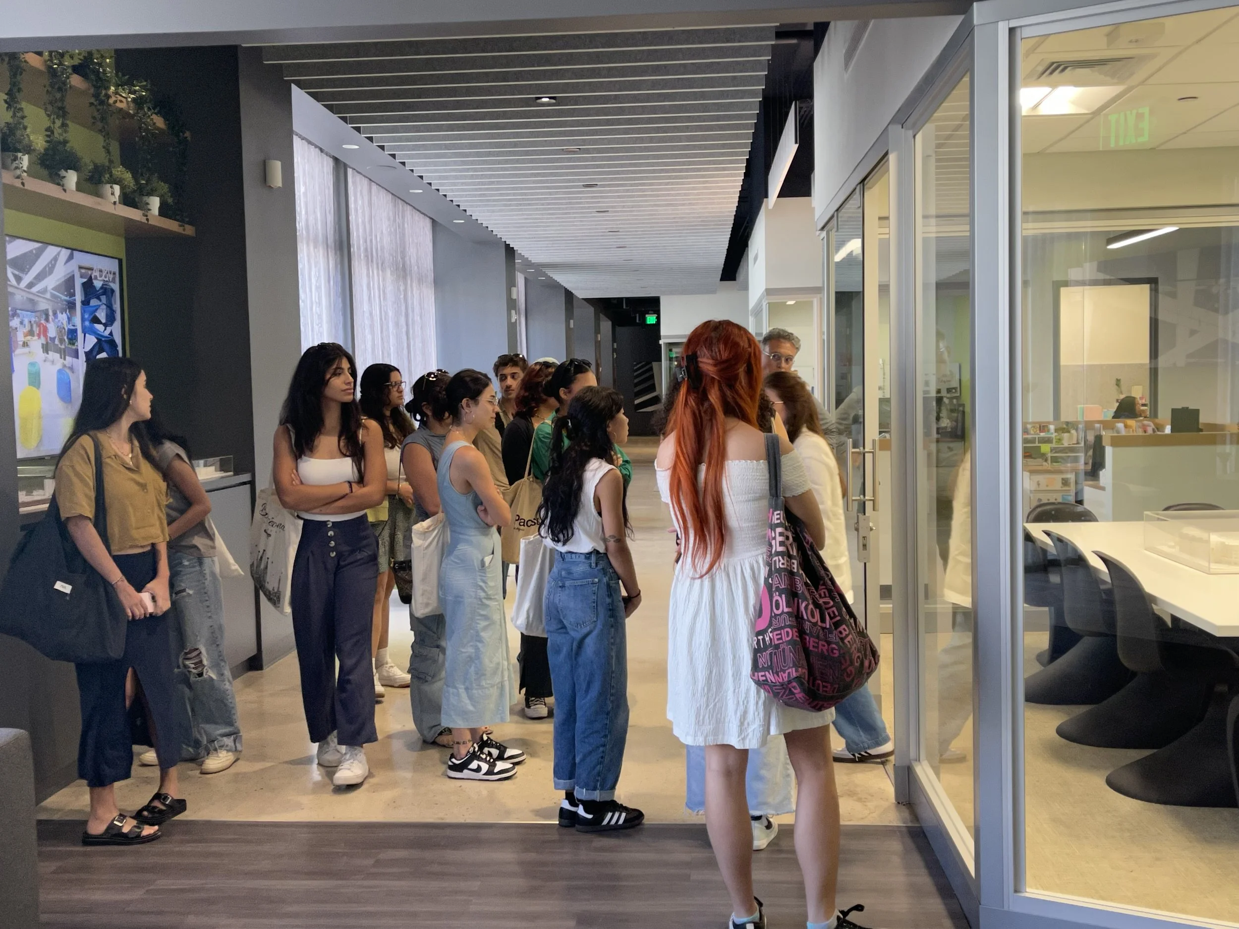 AD&V Team Member giving students a tour of the AD&V office.