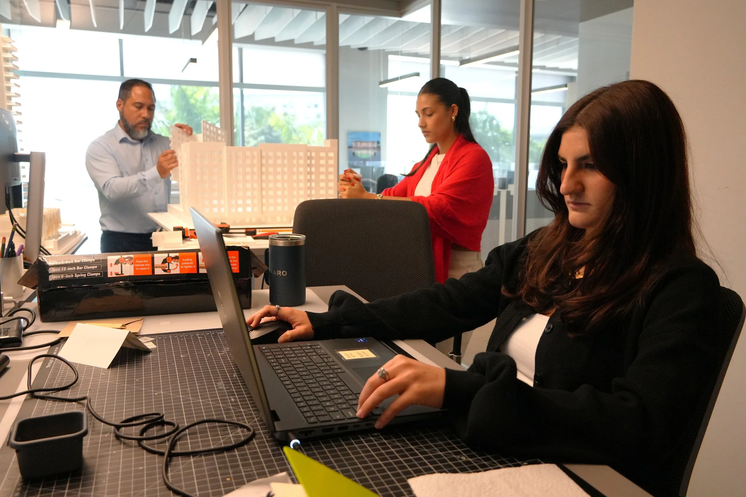 AD&V interns working on a project model.