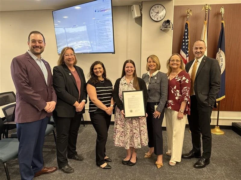 A photo of seven adults recognizing the DuPage County Board’s proclamation of the Week of the Young Child.